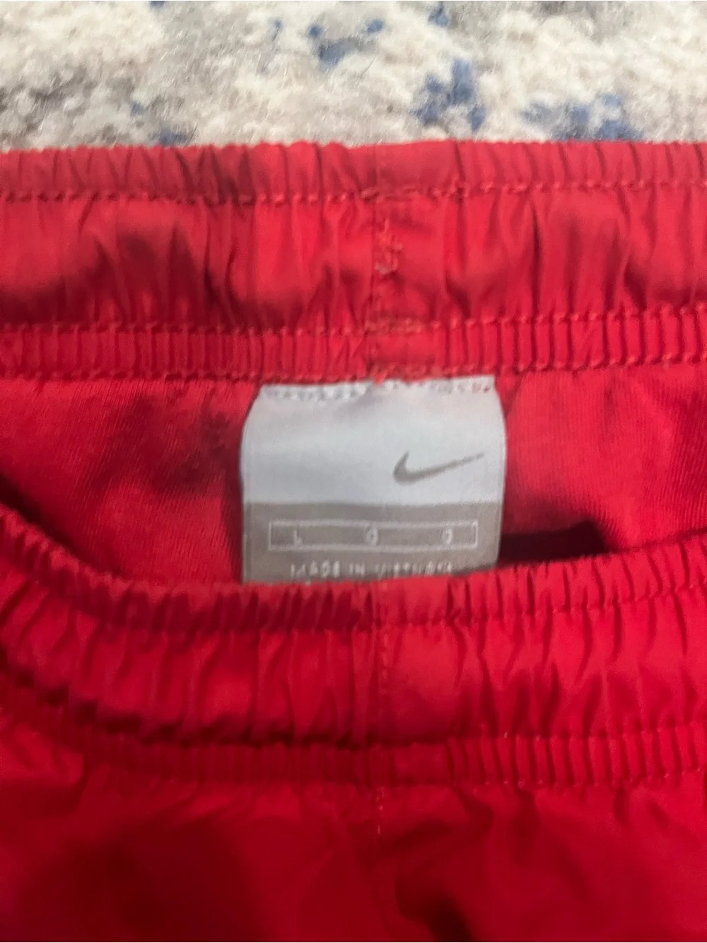 Vintage Nike red track pants with black/white side stripes Size L